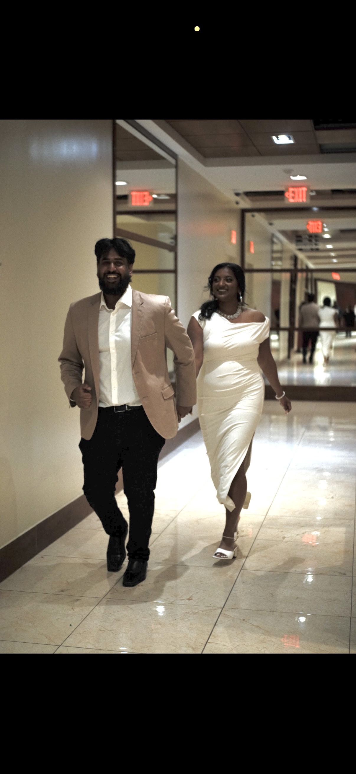 Walking hand in hand, dressed up for the evening